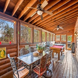 Fox N' Socks' sun room with pool table and hot tub