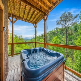 Rustic Retreat's bubbling hot tub