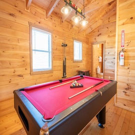 Cabin In The Mountains' pool table and arcade room