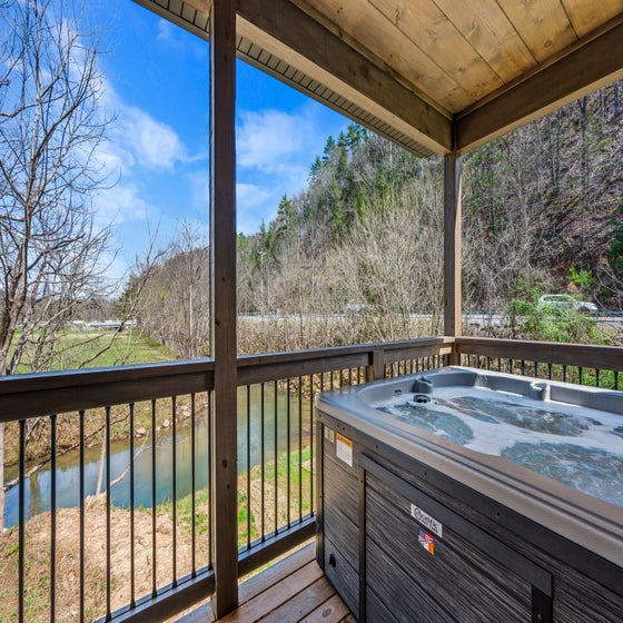 Cabin By The Creek's bubbling hot tub