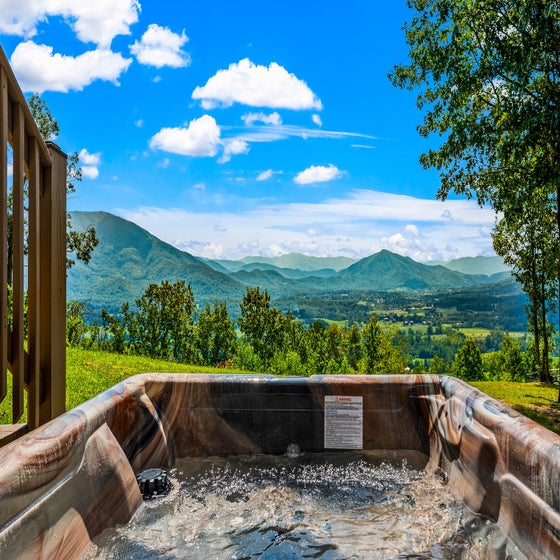 Heavenly Horizon Hideaway's bubbling hot tub with amazing views