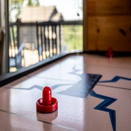 Bear Monkey Lodge's air hockey table