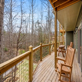 Neverland's spacious deck with outdoor seating