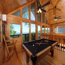 Chubby Bear's loft game room with pool table