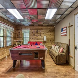 Old Glory's game area with pool table